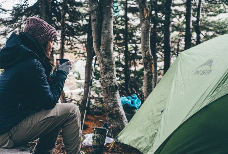 female camper enjoying morning tea