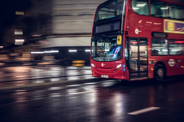 London bus moving on a rainy night